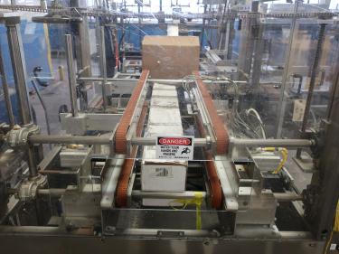 Case Packer Econocorp, Inc side-load case packer model Econocaser, up to 600 cartons per hour